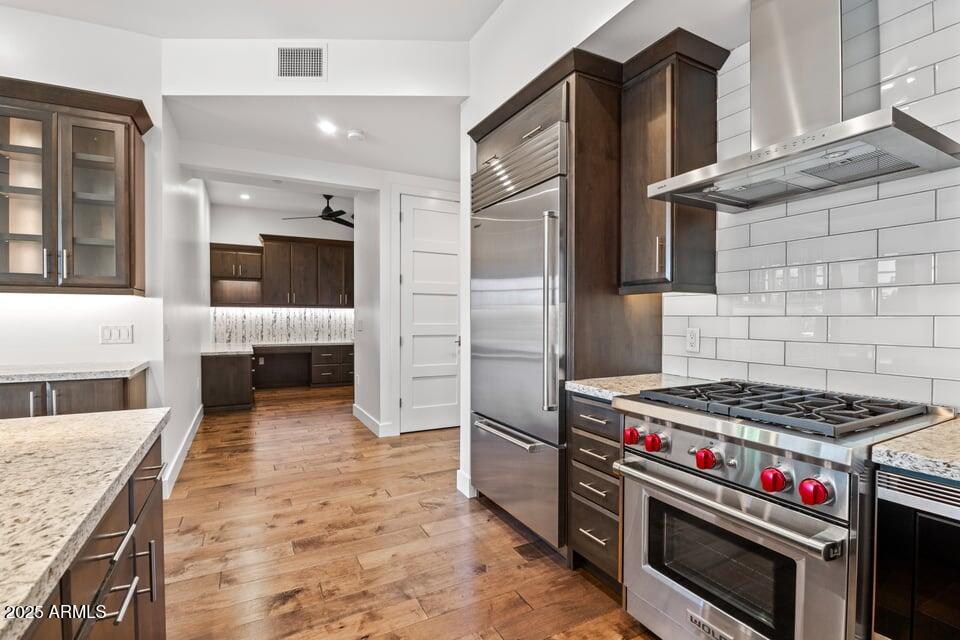 6166 North Scottsdale Road, Unit B2008 Paradise Valley, AZ 85253 - Photo 16 of 69 a kitchen with granite countertop a stove and a refrigerator