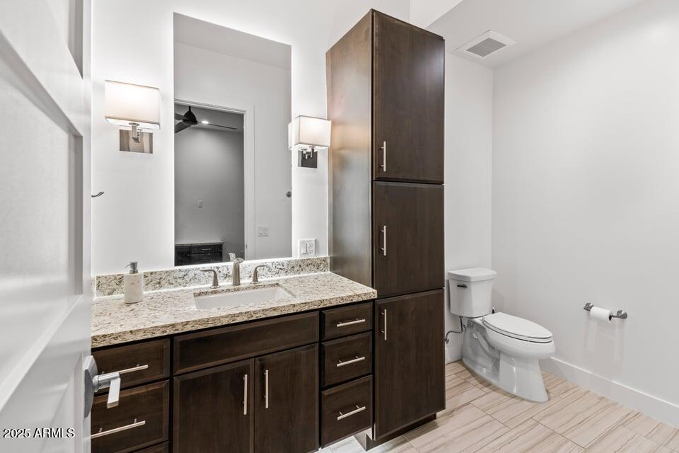 6166 North Scottsdale Road, Unit B2008 Paradise Valley, AZ 85253 - Photo 25 of 69 a bathroom with a granite countertop sink toilet and shower