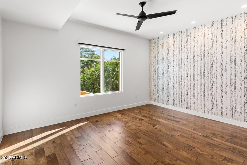 6166 North Scottsdale Road, Unit B2008 Paradise Valley, AZ 85253 - Photo 27 of 69 a view of an empty room with wooden floor and a window