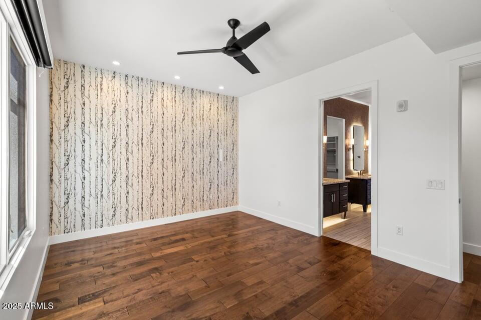6166 North Scottsdale Road, Unit B2008 Paradise Valley, AZ 85253 - Photo 29 of 69 an empty room with wooden floor wooden floor and windows
