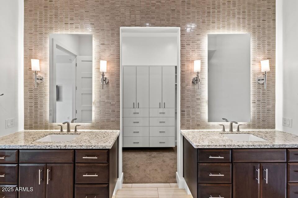 6166 North Scottsdale Road, Unit B2008 Paradise Valley, AZ 85253 - Photo 34 of 69 a bathroom with a granite countertop sink and a mirror
