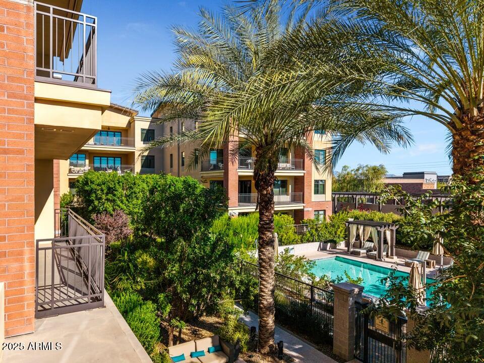 6166 North Scottsdale Road, Unit B2008 Paradise Valley, AZ 85253 - Photo 39 of 69 a front view of a multi story residential apartment building with a yard