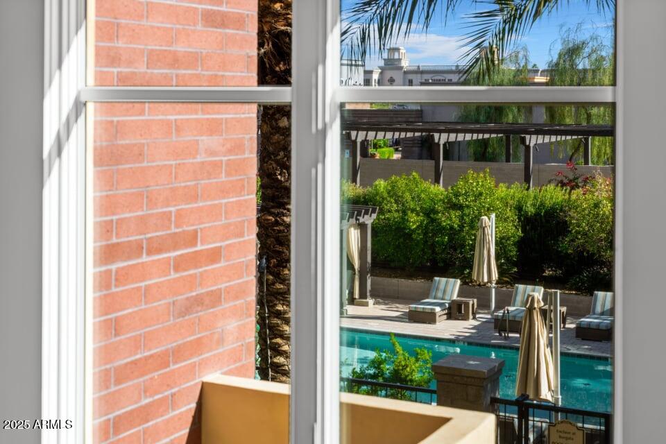 6166 North Scottsdale Road, Unit B2008 Paradise Valley, AZ 85253 - Photo 43 of 69 a view of a chair and tables in the balcony