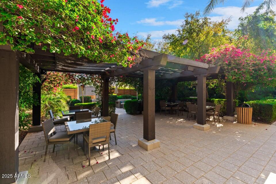 6166 North Scottsdale Road, Unit B2008 Paradise Valley, AZ 85253 - Photo 44 of 69 a view of a patio with a table and chairs and potted plants