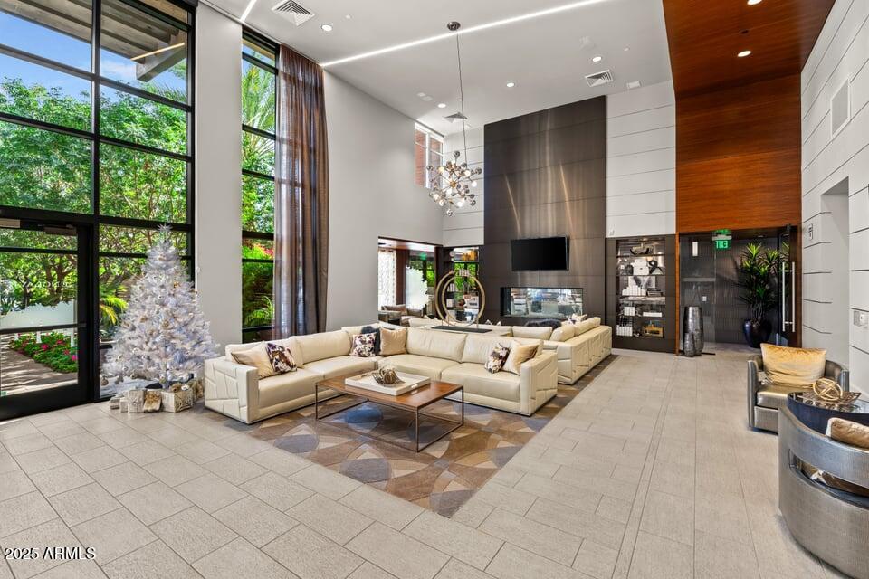 6166 North Scottsdale Road, Unit B2008 Paradise Valley, AZ 85253 - Photo 54 of 69 a living room with furniture and large windows
