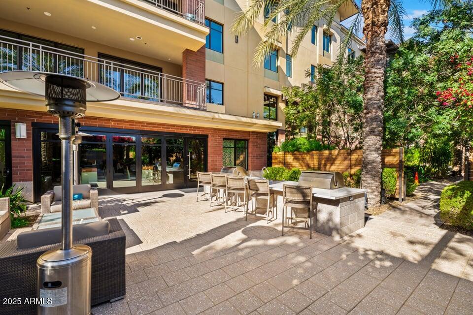 6166 North Scottsdale Road, Unit B2008 Paradise Valley, AZ 85253 - Photo 61 of 69 a view of a building with sitting area