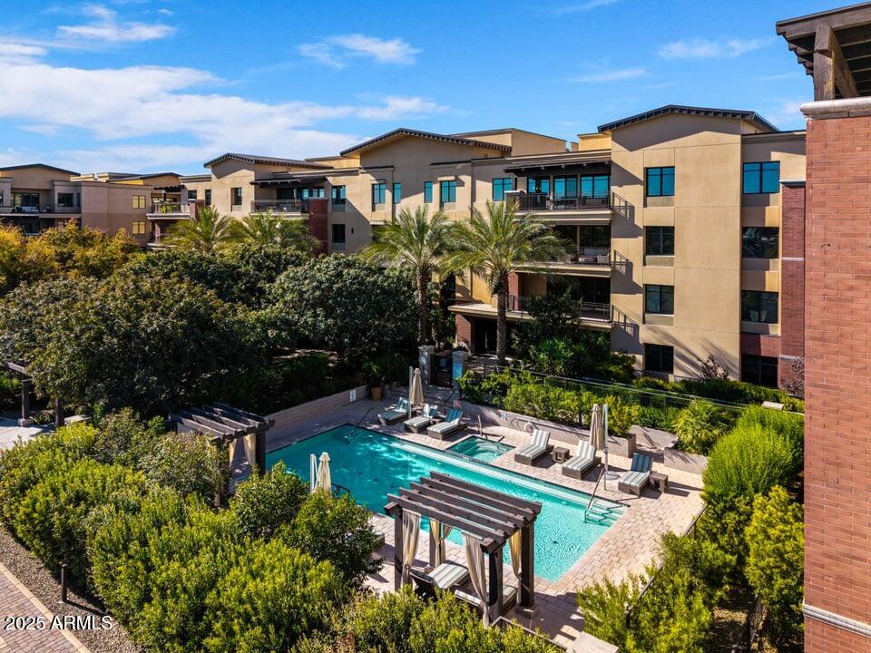 6166 North Scottsdale Road, Unit B2008 Paradise Valley, AZ 85253 - Photo 64 of 69 a front view of a house with yard and sitting area