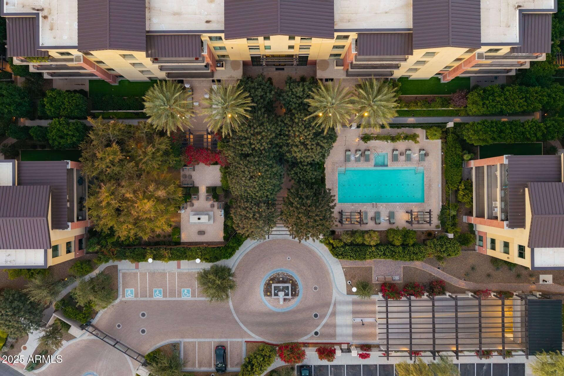 6166 North Scottsdale Road, Unit B2008 Paradise Valley, AZ 85253 - Photo 65 of 69 an aerial view of a house with a yard and a large tree
