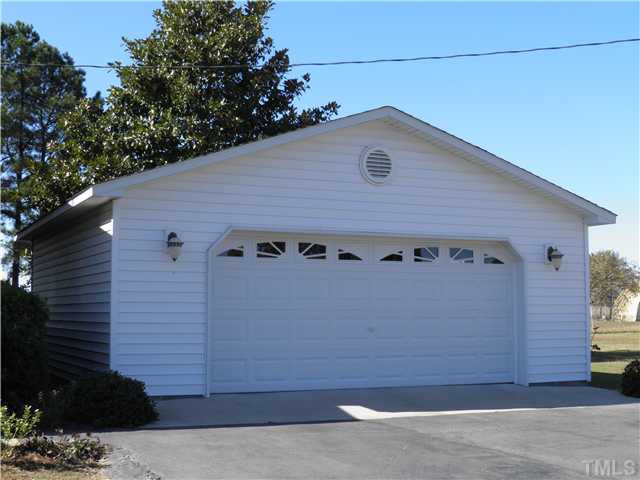 2221 Cooper Branch Road Clayton, NC 27520 - Photo 2 of 15 Detached 24 x 24 garage added around 3 years ago. Oversized space allows room for storage or a workshop.