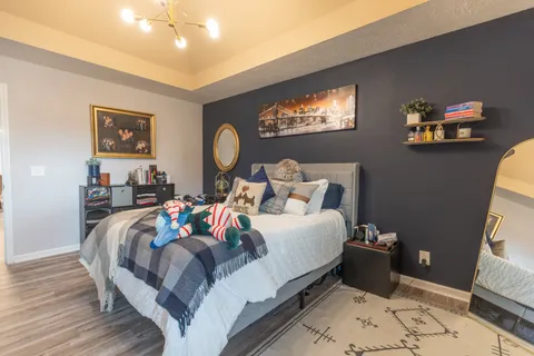 a bedroom with bed and a window