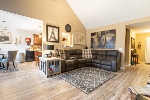 a living room with furniture and a rug