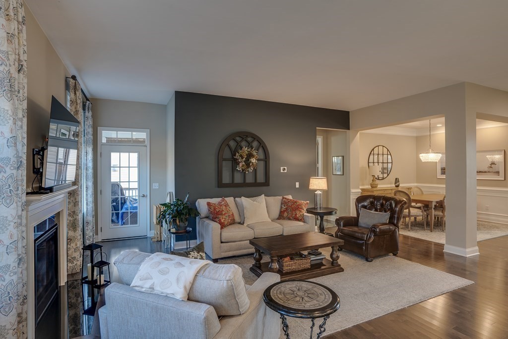 20 Sequoia Drive, Unit 20 Methuen, MA 01844 - Photo 12 of 42 a living room with furniture a fireplace and a chandelier