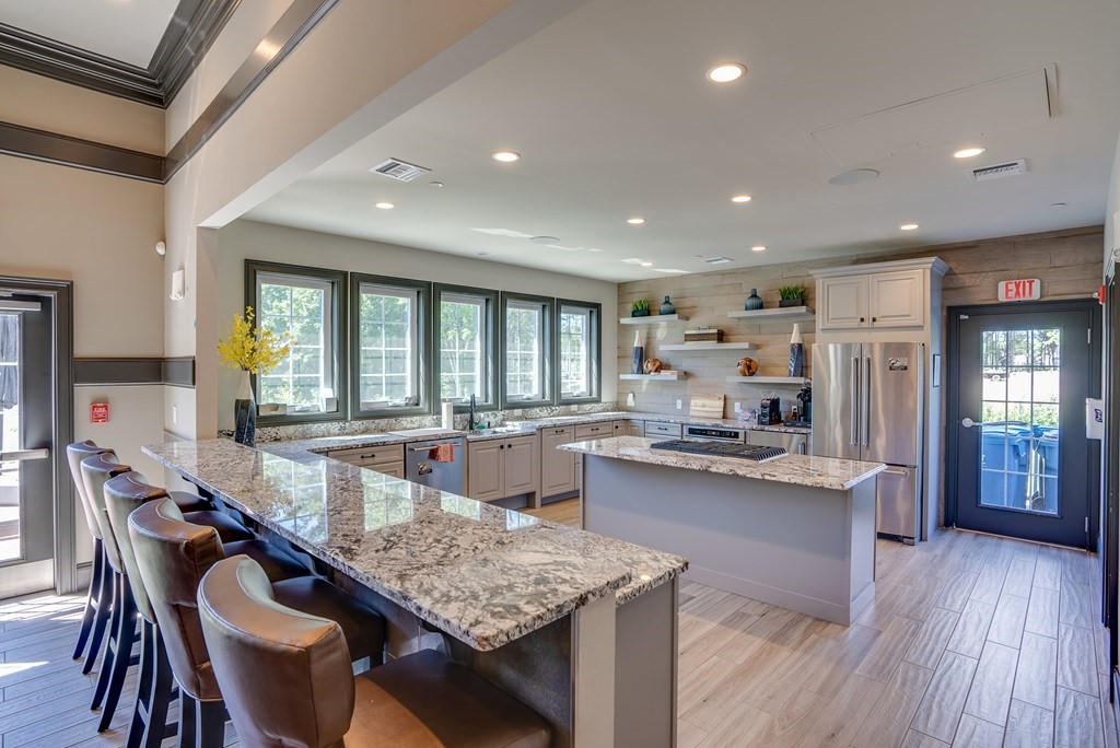 20 Sequoia Drive, Unit 20 Methuen, MA 01844 - Photo 34 of 42 a kitchen with a table and chairs in it