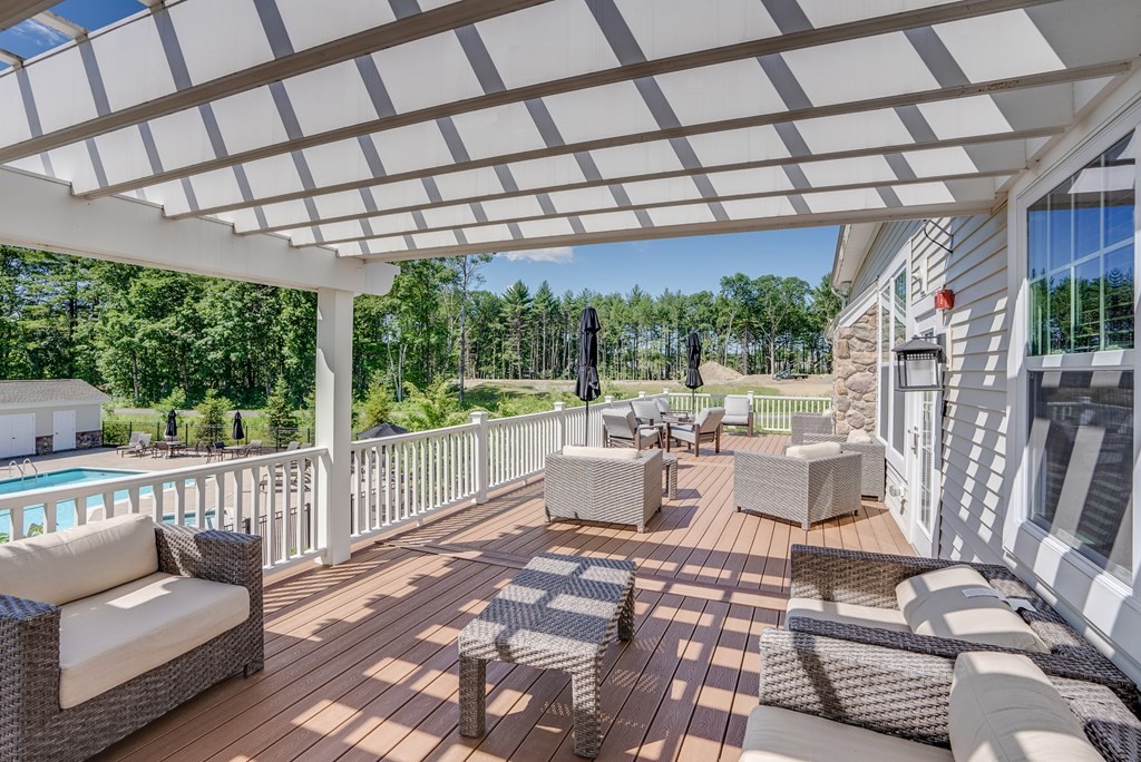 20 Sequoia Drive, Unit 20 Methuen, MA 01844 - Photo 39 of 42 a view of a patio with couches plants and wooden floor