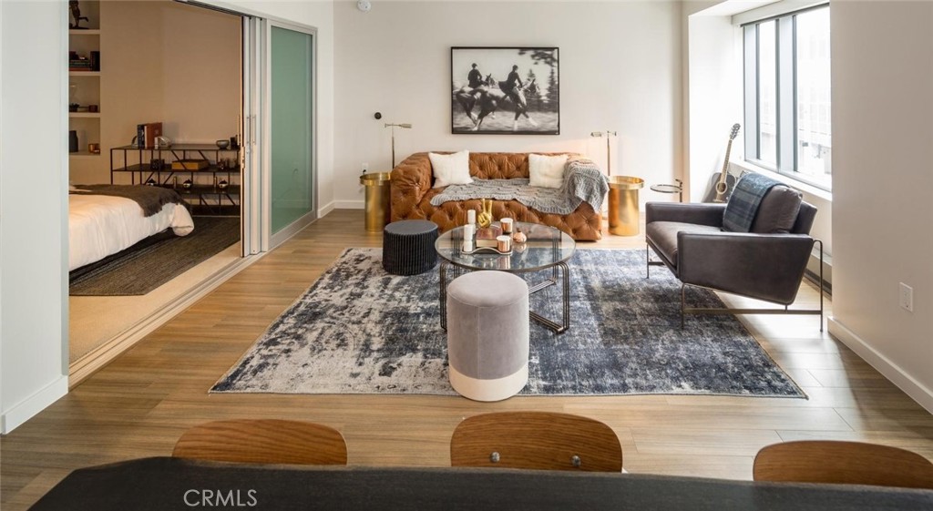 150 Van Ness Avenue, Unit 1036 San Francisco, CA 94102 - Photo 11 of 75 a living room with furniture and a couch