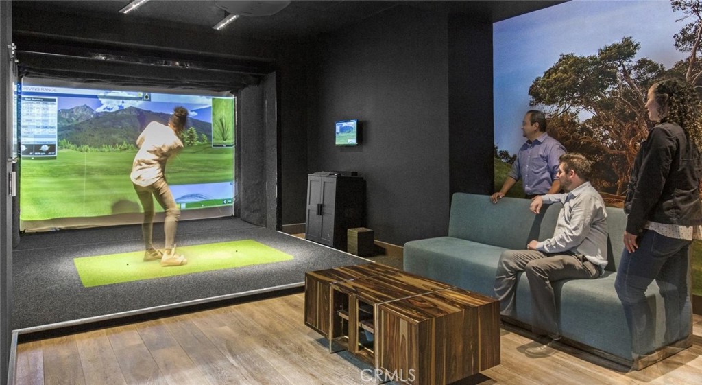 150 Van Ness Avenue, Unit 1036 San Francisco, CA 94102 - Photo 26 of 75 a living room with furniture and a flat screen tv
