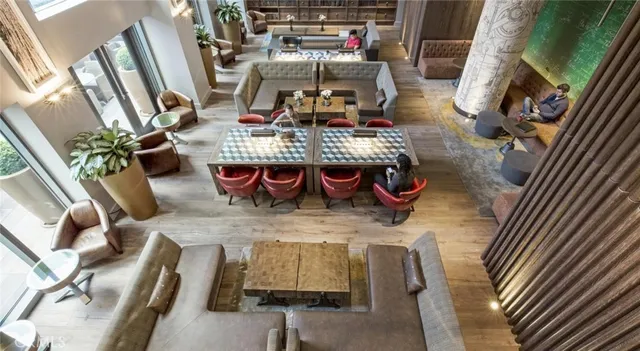 a view of a living room and kitchen with furniture
