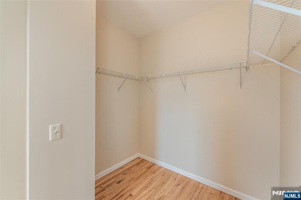 280 Main Street, Unit 305 Little Falls, NJ 07424 - Photo 14 of 24 a view of a small space with wooden floor and a window