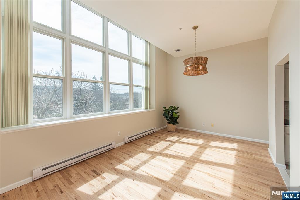 280 Main Street, Unit 305 Little Falls, NJ 07424 - Photo 5 of 24 a view of an empty room with a window