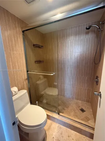 a bathroom with a sink a mirror and a toilet