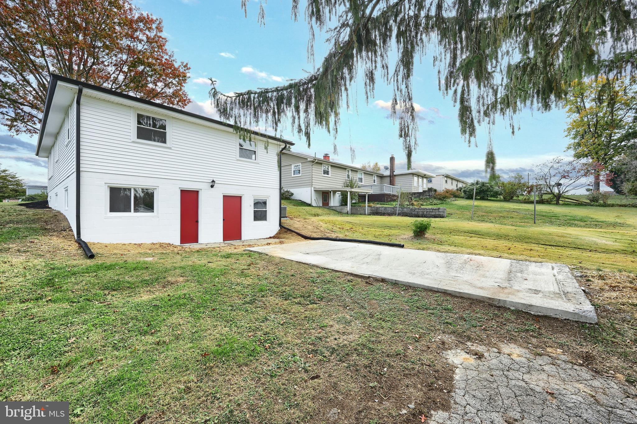 52 Oak Drive Hanover, PA 17331 - Photo 11 of 41 a view of a house with a yard and palm trees