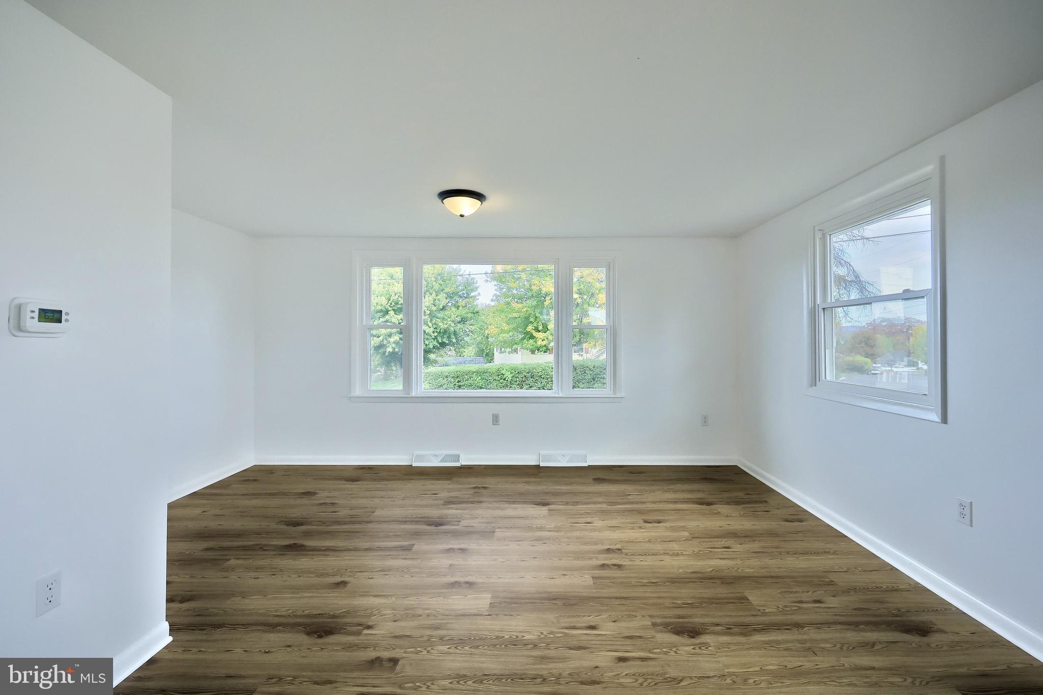 52 Oak Drive Hanover, PA 17331 - Photo 15 of 41 wooden floor in an empty room with a window