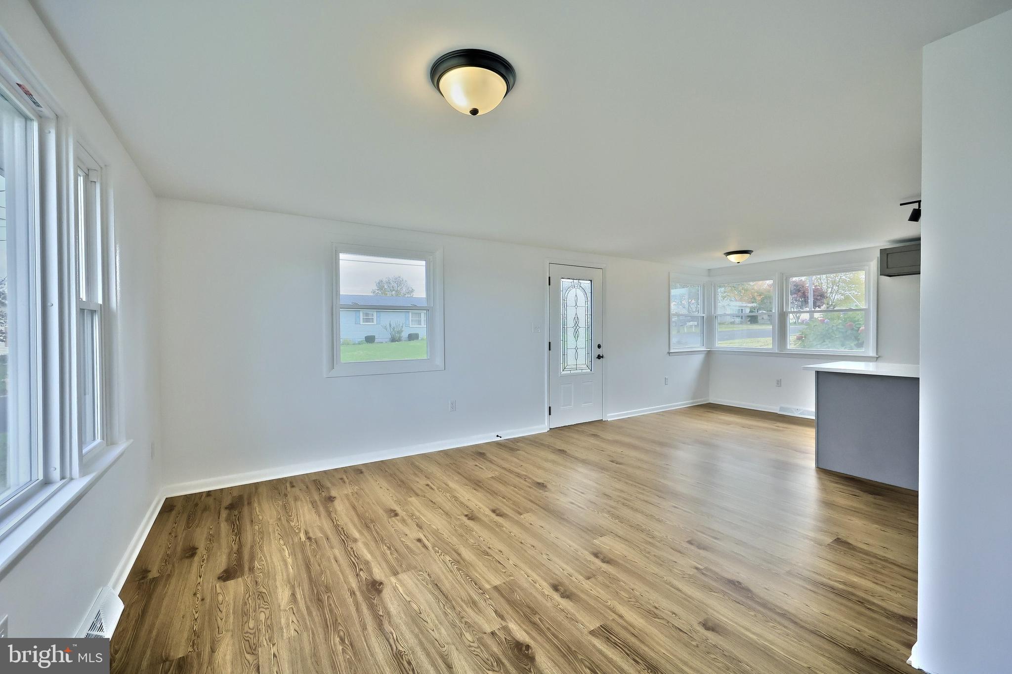 52 Oak Drive Hanover, PA 17331 - Photo 16 of 41 an empty room with wooden floor and windows
