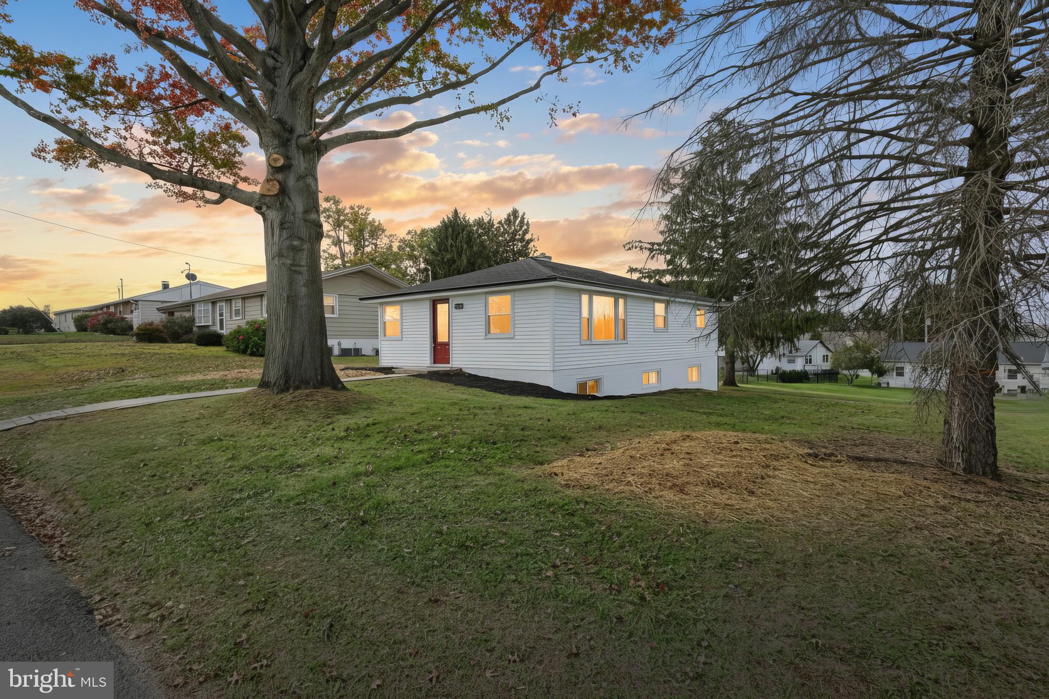52 Oak Drive Hanover, PA 17331 - Photo 2 of 41 a view of house with backyard and trees