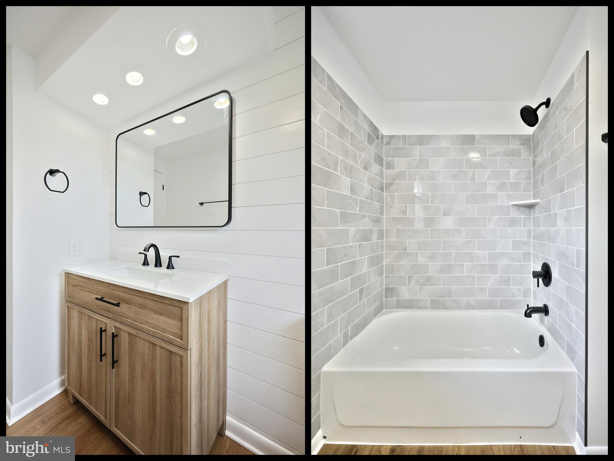 52 Oak Drive Hanover, PA 17331 - Photo 22 of 41 a bathroom with a bathtub a mirror a sink and vanity