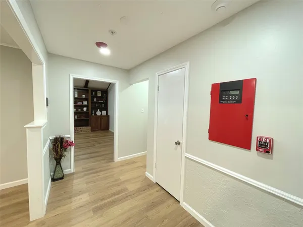a view of a dining room and livingroom with furniture wooden floor