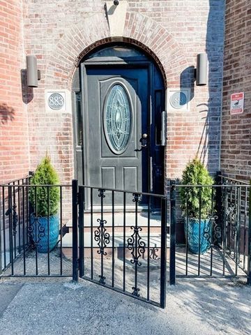 a clock on a table in front of a building
