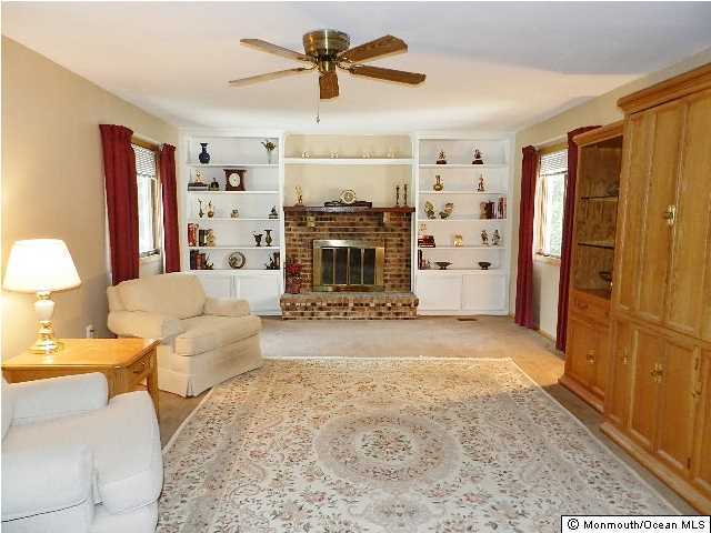 112 Jordan Road Brick, NJ 08724 - Photo 13 of 25 a living room with furniture a ceiling fan and a rug