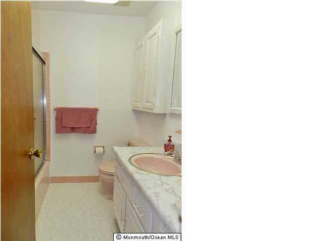 112 Jordan Road Brick, NJ 08724 - Photo 17 of 25 a bathroom with a granite countertop sink a toilet and shower