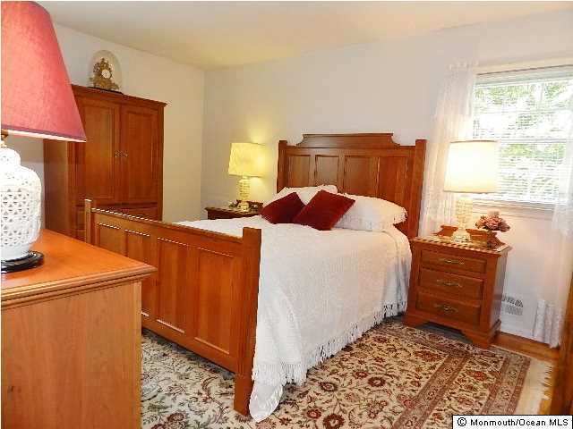 112 Jordan Road Brick, NJ 08724 - Photo 20 of 25 a bedroom with a bed and a dresser