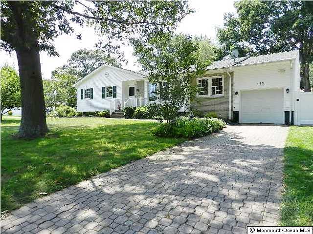 112 Jordan Road Brick, NJ 08724 - Photo 3 of 25 a front view of a house with a yard and trees