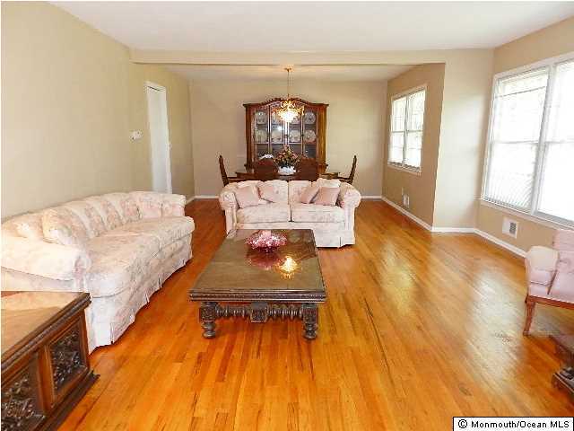 112 Jordan Road Brick, NJ 08724 - Photo 5 of 25 a living room with furniture and a chandelier