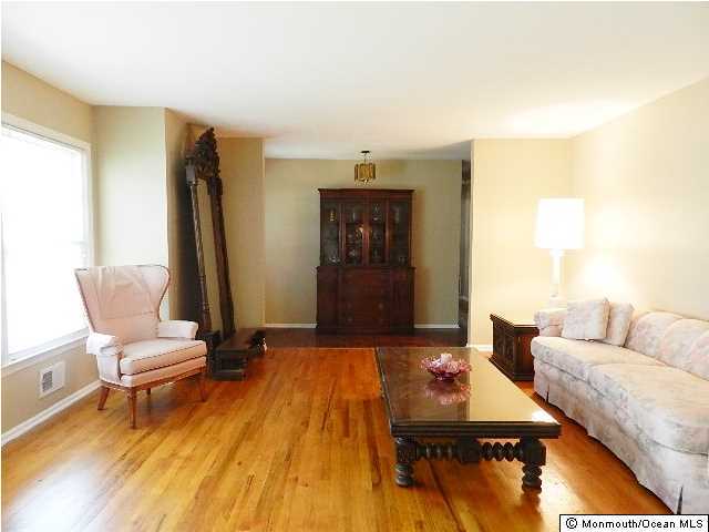 112 Jordan Road Brick, NJ 08724 - Photo 7 of 25 a living room with furniture and a wooden floor