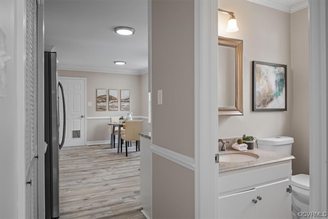 4606 Brookridge Road Chesterfield, VA 23832 - Photo 14 of 48 a hallway with a sink and a mirror
