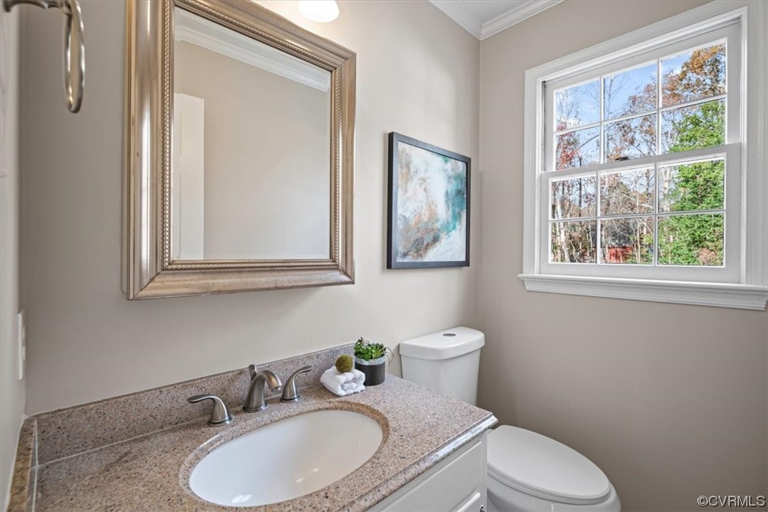 4606 Brookridge Road Chesterfield, VA 23832 - Photo 15 of 48 a bathroom with a granite countertop toilet sink and mirror