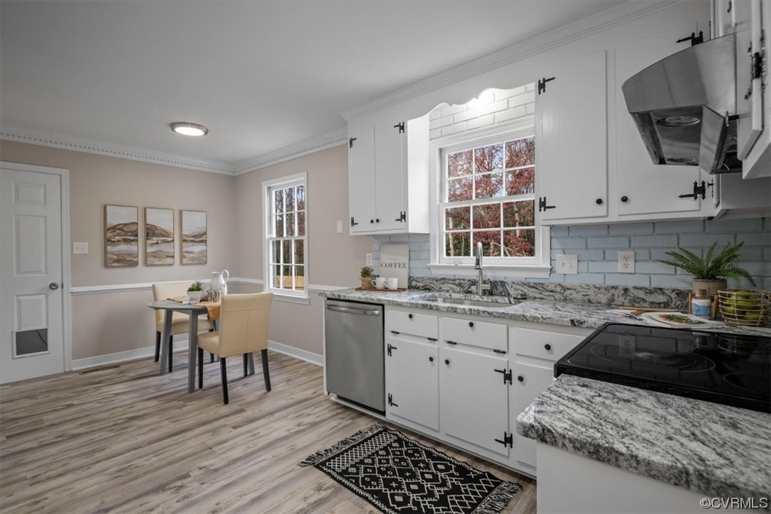 4606 Brookridge Road Chesterfield, VA 23832 - Photo 16 of 48 a kitchen with granite countertop a sink stove and cabinets