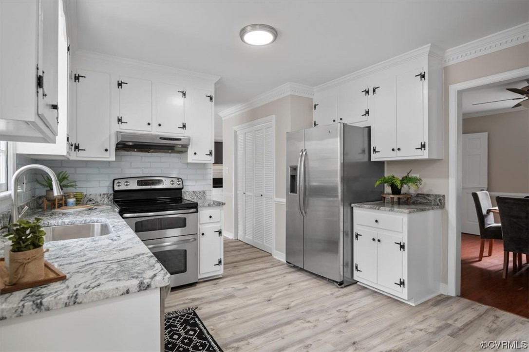 4606 Brookridge Road Chesterfield, VA 23832 - Photo 18 of 48 a kitchen with granite countertop a refrigerator stove and sink
