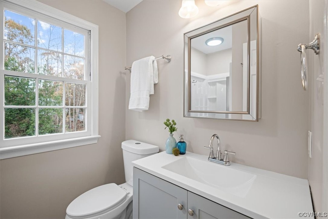 4606 Brookridge Road Chesterfield, VA 23832 - Photo 30 of 48 a bathroom with a granite countertop sink mirror and a toilet