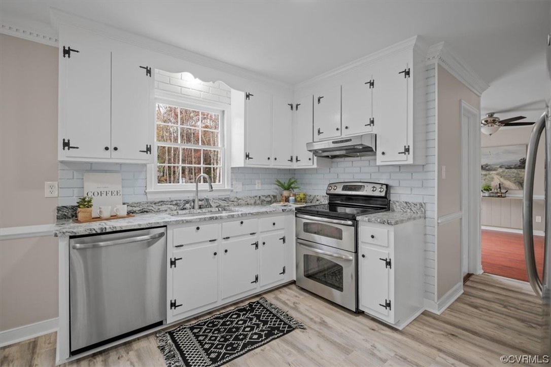 4606 Brookridge Road Chesterfield, VA 23832 - Photo 3 of 48 a kitchen with granite countertop a sink cabinets stainless steel appliances and a window