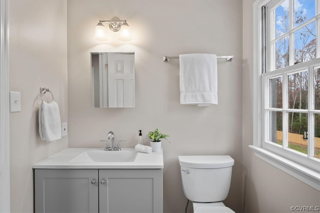 4606 Brookridge Road Chesterfield, VA 23832 - Photo 34 of 48 a bathroom with a toilet sink and mirror