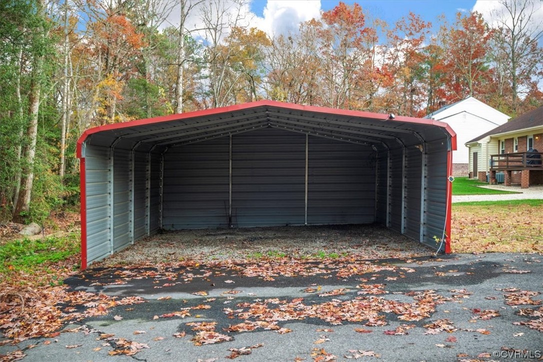 4606 Brookridge Road Chesterfield, VA 23832 - Photo 48 of 48 a view of a house with a small yard and large tree