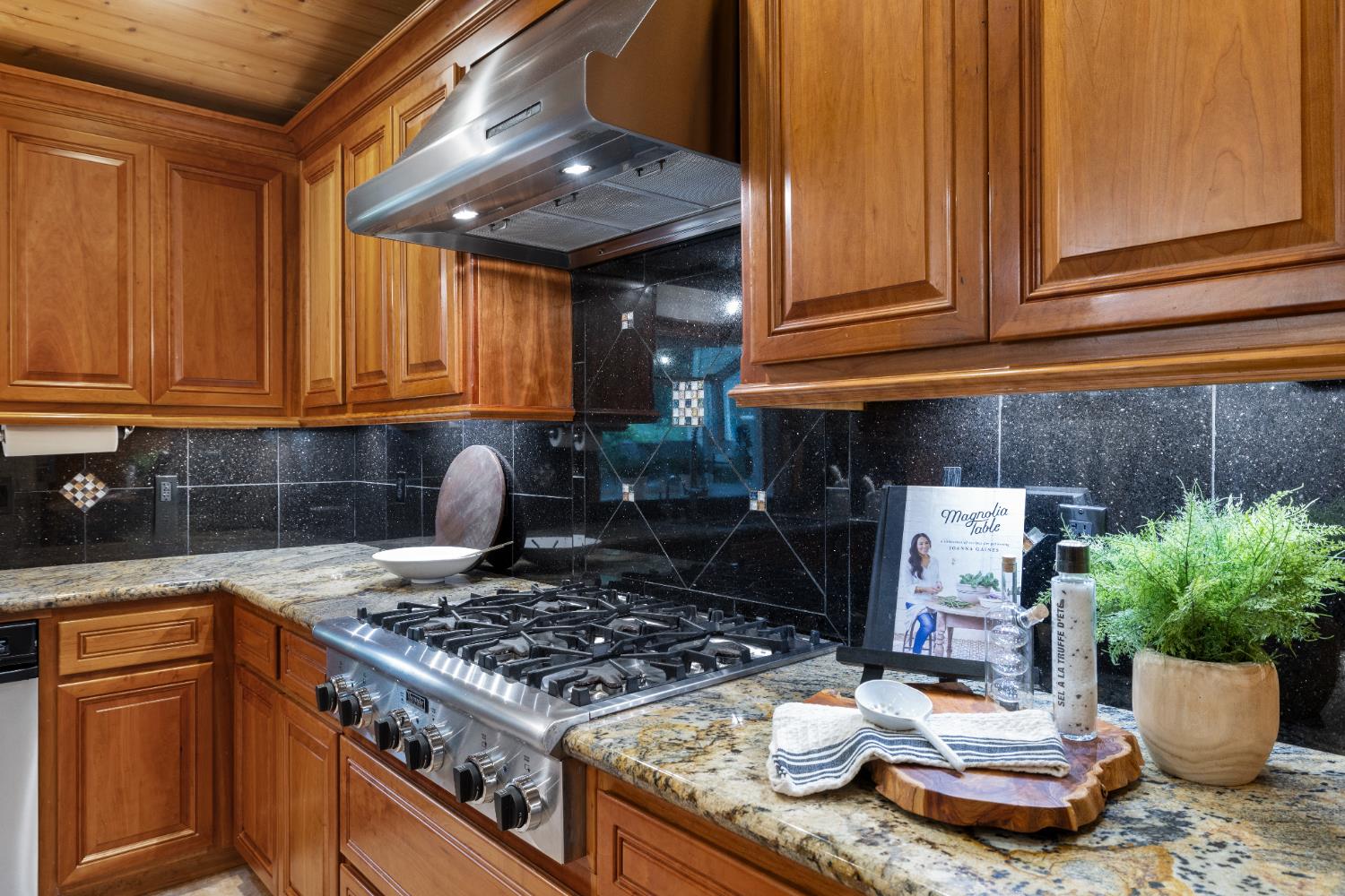 7396 Callison Road Penryn, CA 95663 - Photo 21 of 99 Cherry Cabinets Thermador gas cooktop.