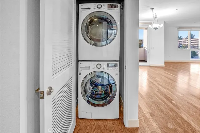 a view of a hallway with washer and dryer