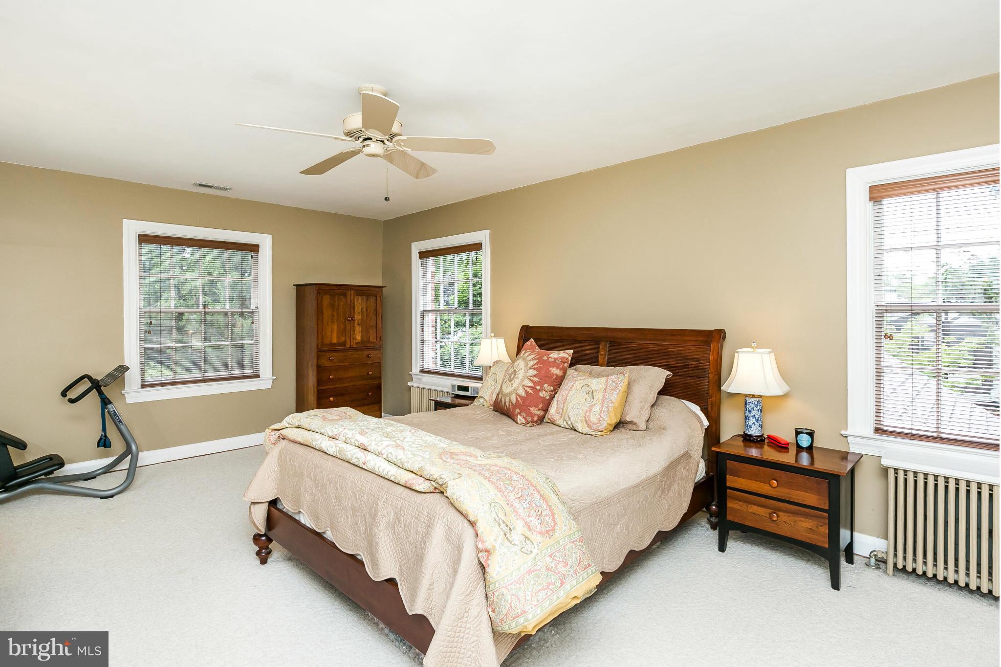 203 Midhurst Road Baltimore, MD 21212 - Photo 16 of 30 a spacious bedroom with a bed and a window