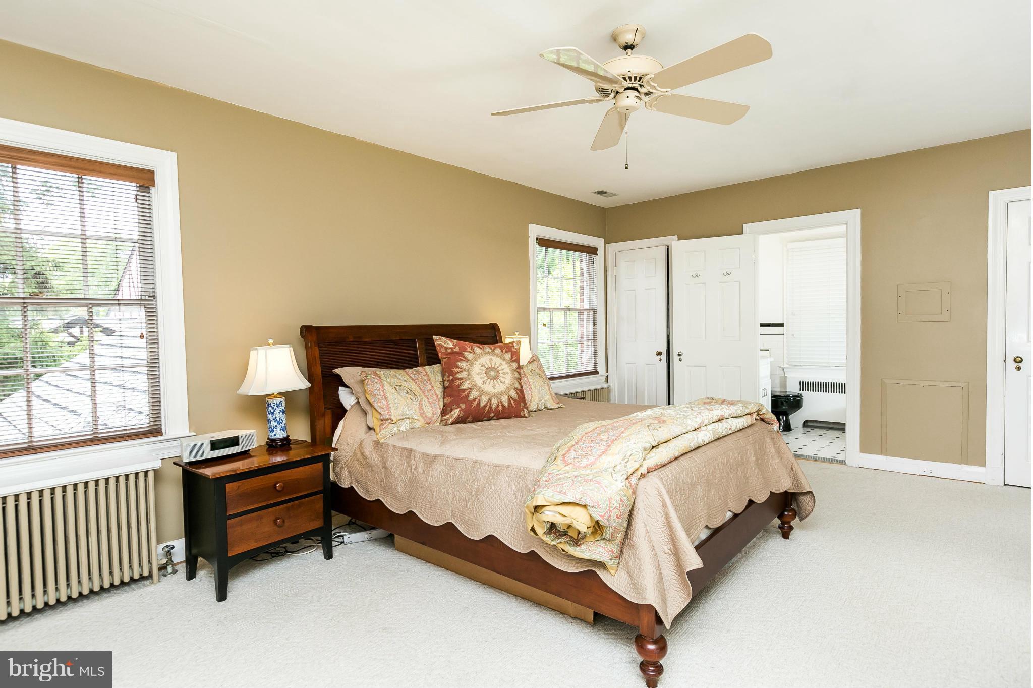 203 Midhurst Road Baltimore, MD 21212 - Photo 17 of 30 a bedroom with a bed and a chandelier
