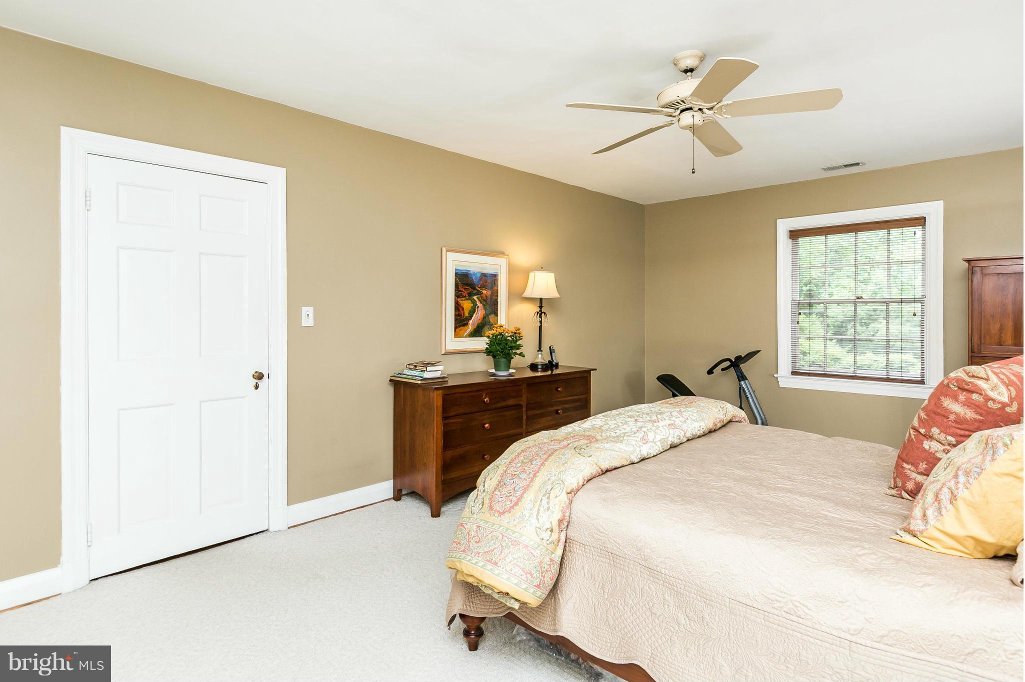 203 Midhurst Road Baltimore, MD 21212 - Photo 18 of 30 a bedroom with a bed and a chandelier